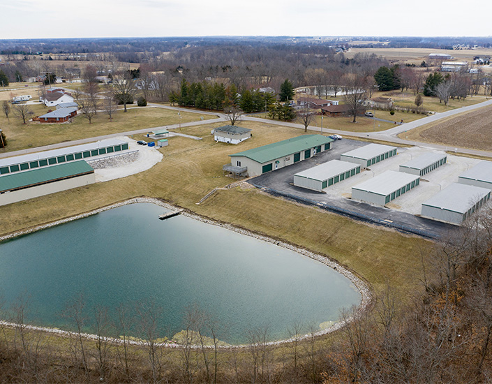 Aerial of the storage units and nearby lake.
